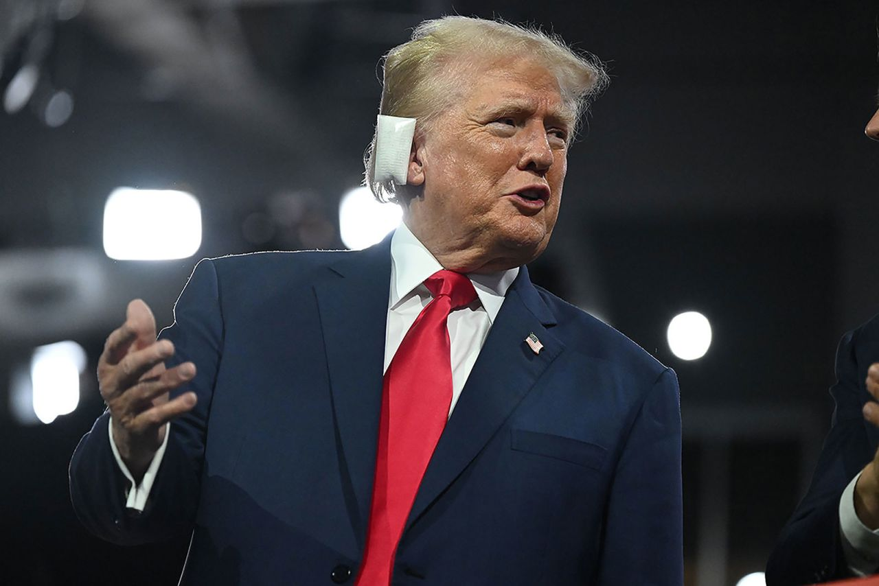 Former US President Donald Trump appears with a bandaged ear on the first night of the Republican National Convention in Milwaukee on July 15.